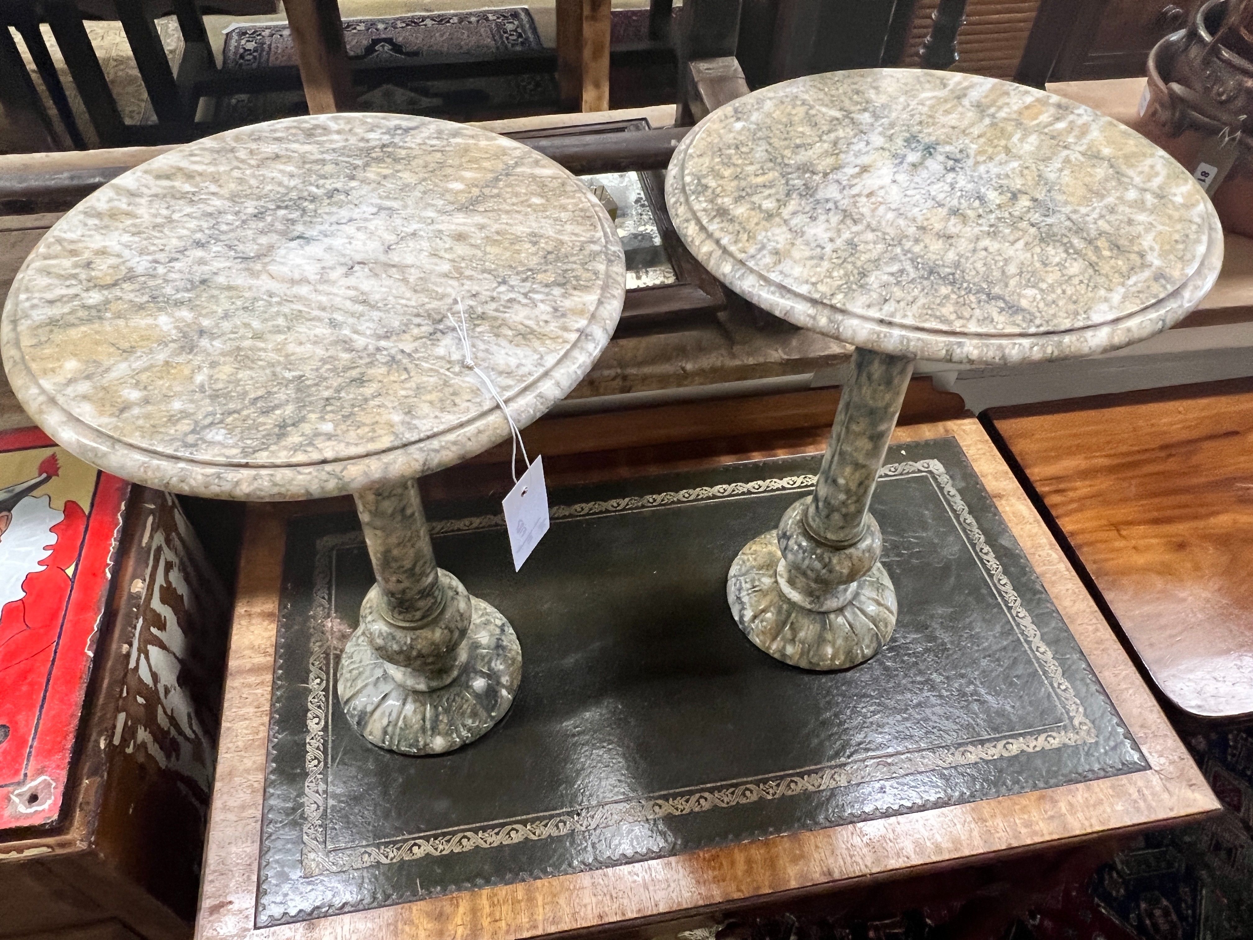 A pair of circular reconstituted marble wine tables, diameter 35cm, height 49cm